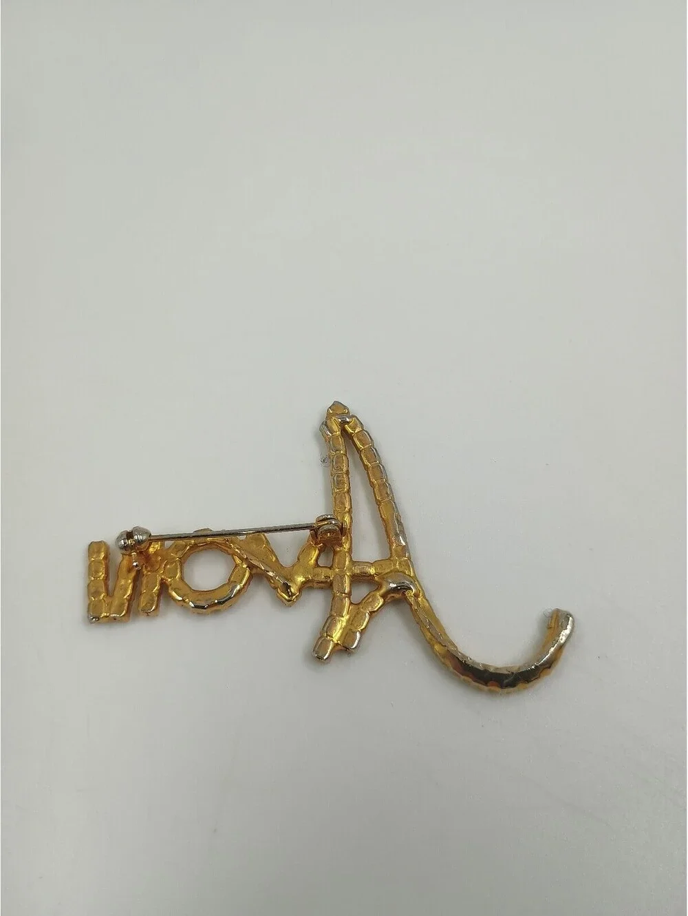 Avon Gold Tone Rhinestone Script Brooch Pin